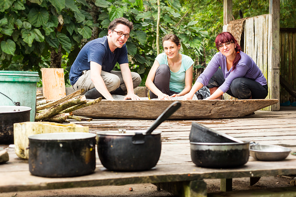 Group of Tourists Preparing Cassava Pie in Ecuador